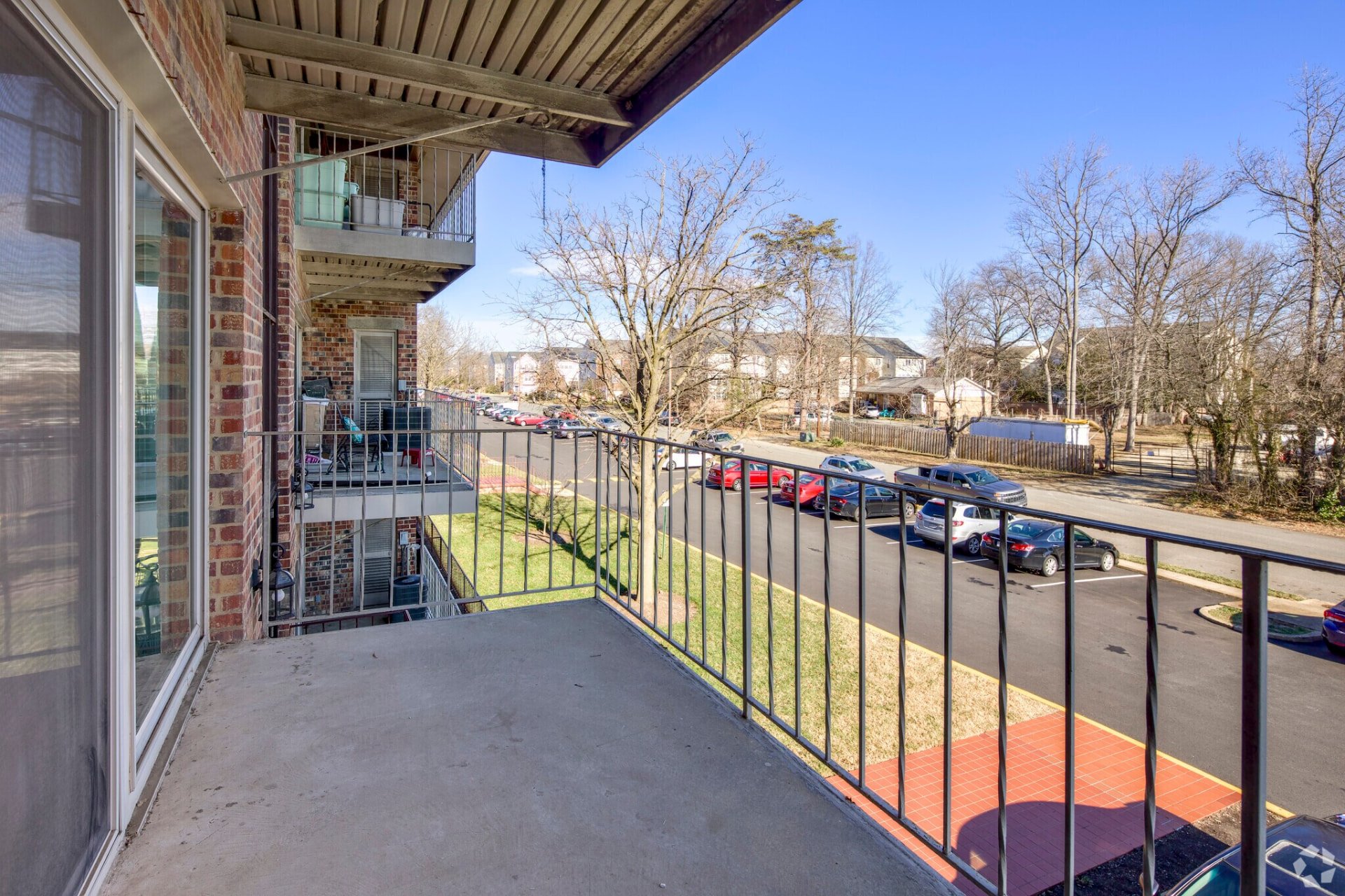 One-bedroom apartment balcony overlooking the community