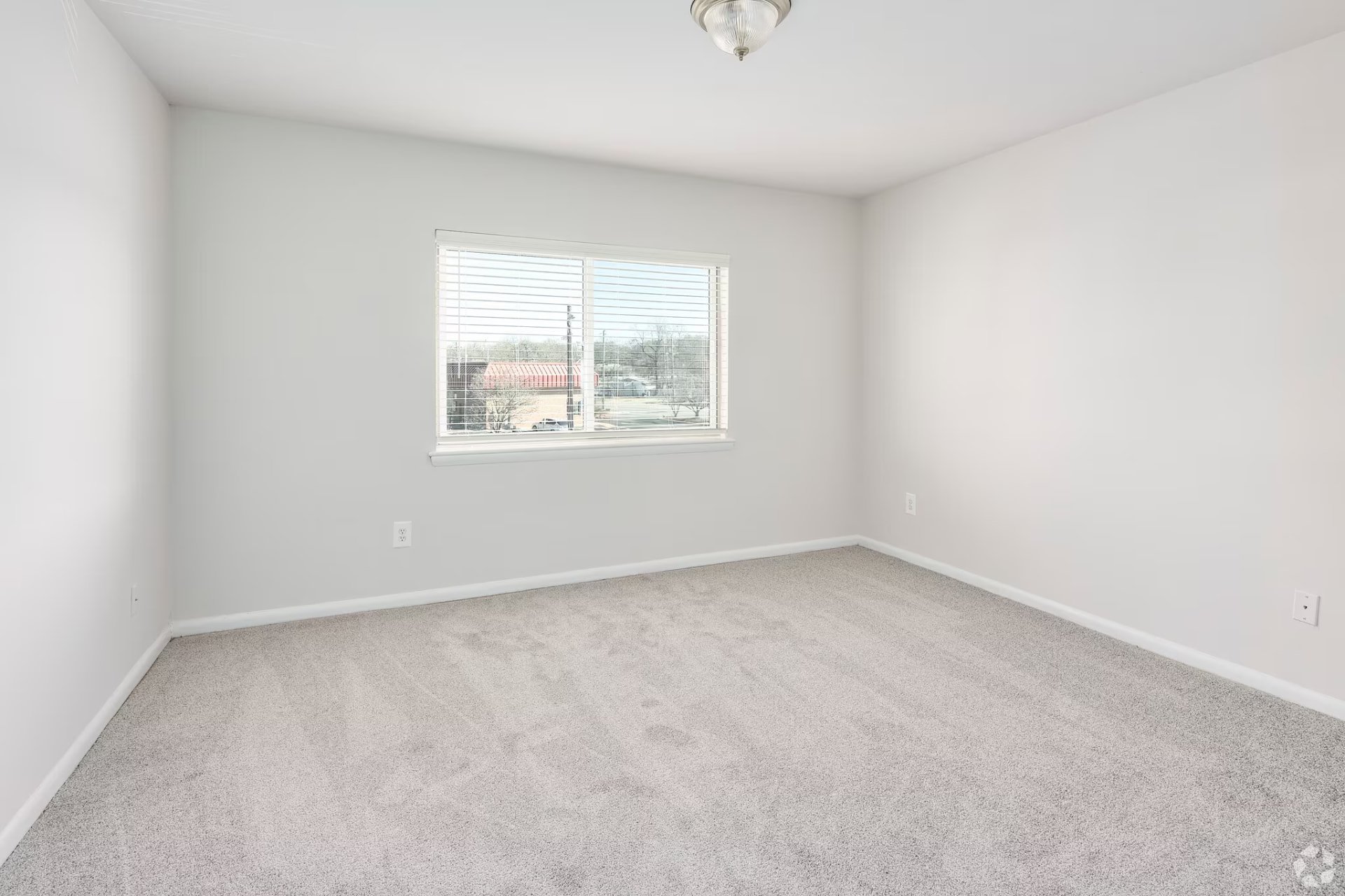 One-bedroom apartment carpeted bedroom
