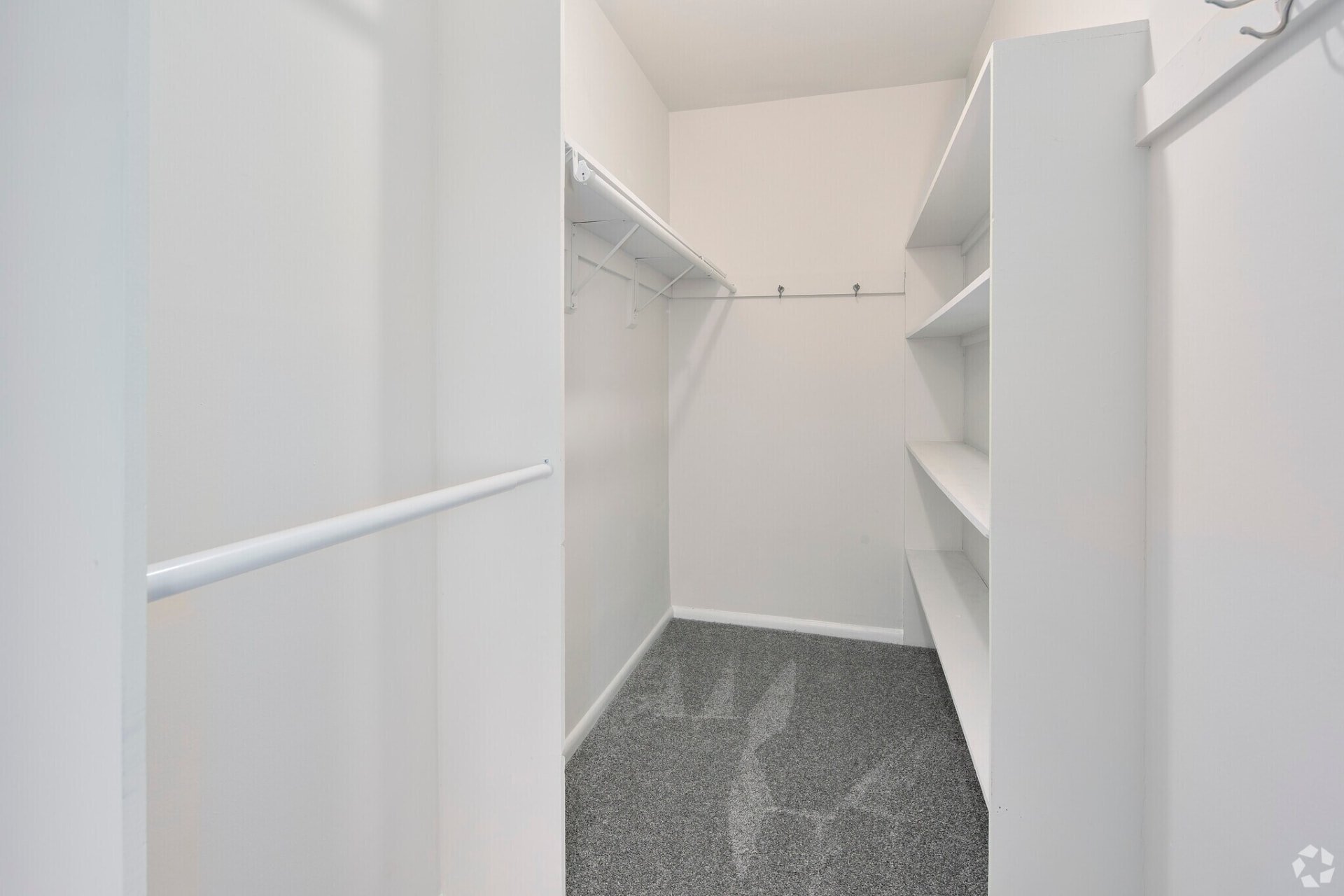 One-bedroom apartment walk-in closet with shelving
