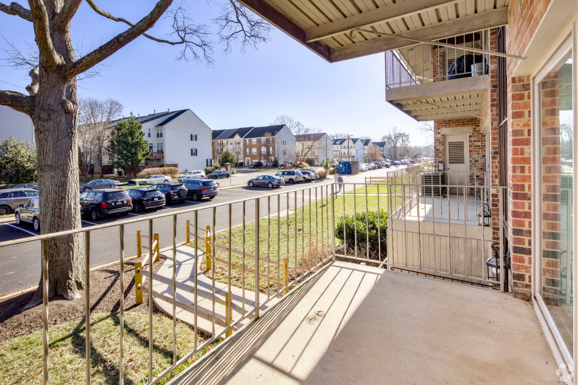 Two-bedroom apartment balcony overlooking neighboring buildings
