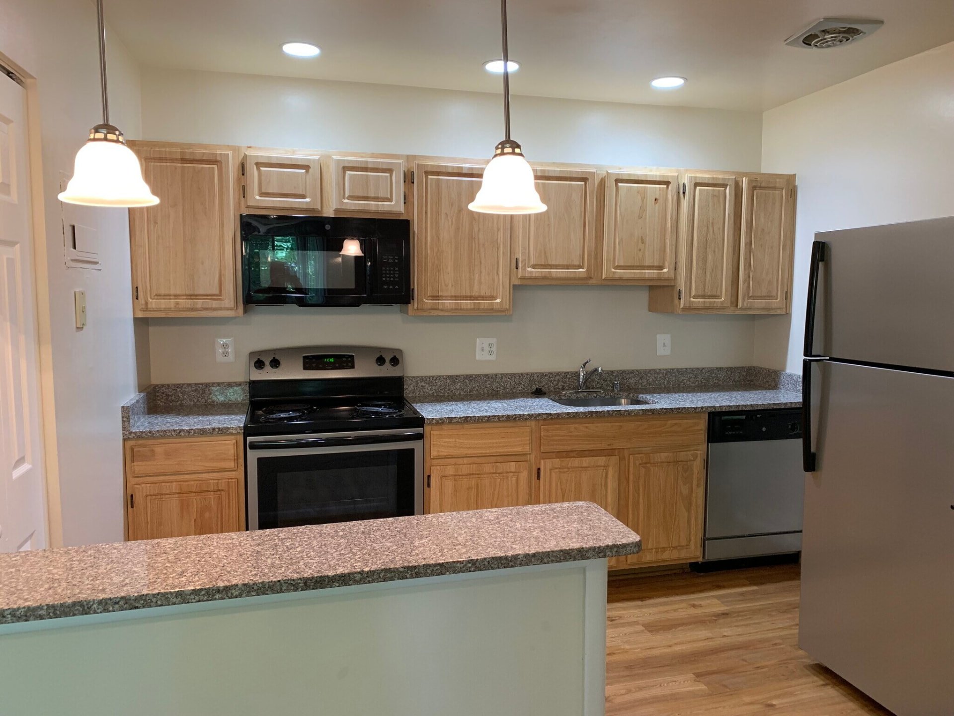 Kitchen with oak cabinets and a breakfast bar